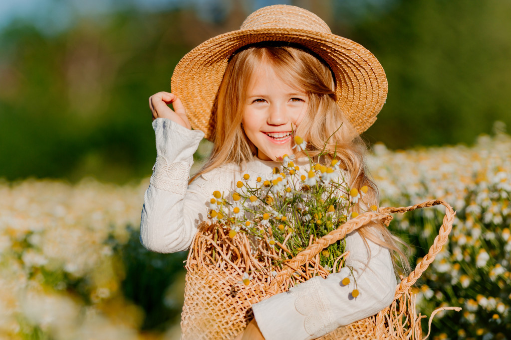 a child holding flowers